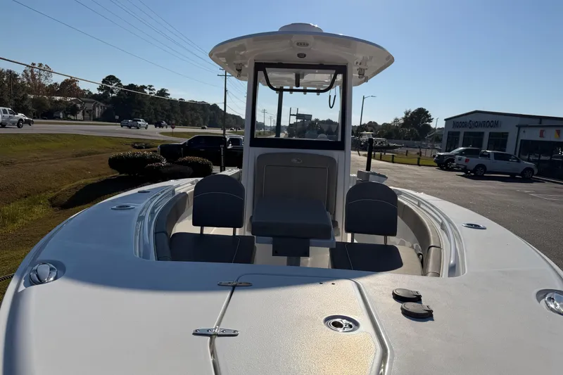 Slide: The Image of 2025 Sea Hunt Gamefish 27 Forward Seating boat in parking lot, sunny day. - 8