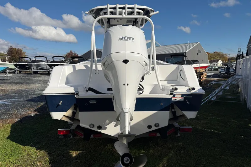 Slide: The Image of 2021 Sportsman Heritage 251 Center Console boat with powerful outboard motor. - 4