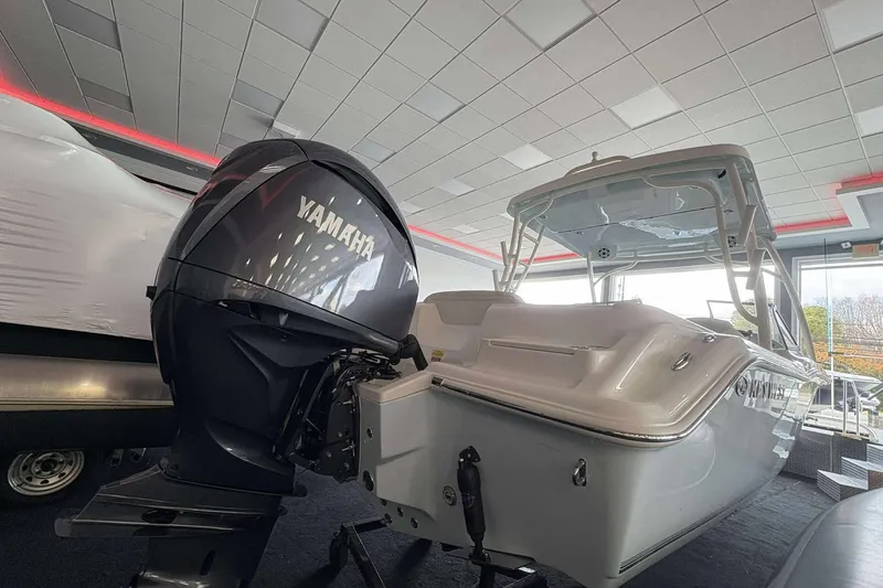 Slide: The Image of 2026 Key West 239 DFS boat with Yamaha outboard motor in showroom. - 19