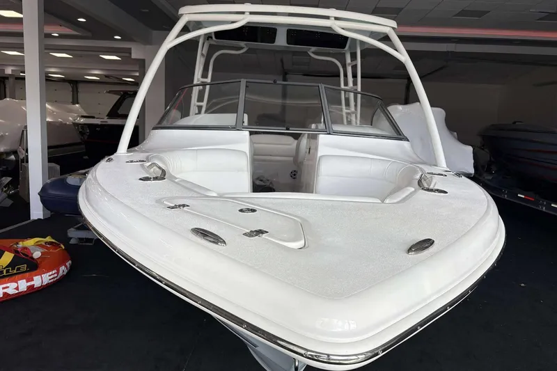 Slide: The Image of 2026 Key West 239 DFS boat with sleek white design in showroom. - 4