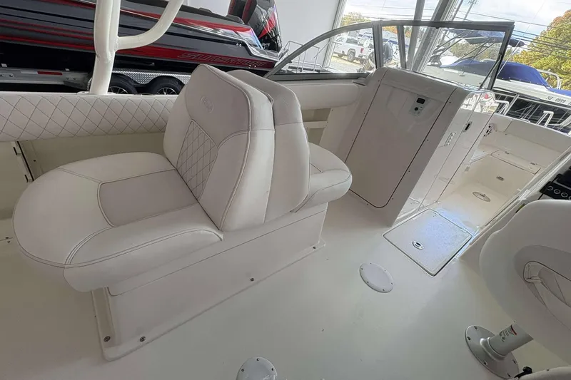 Slide: The Image of 2026 Key West 239 DFS boat interior with white seating and modern design. - 8