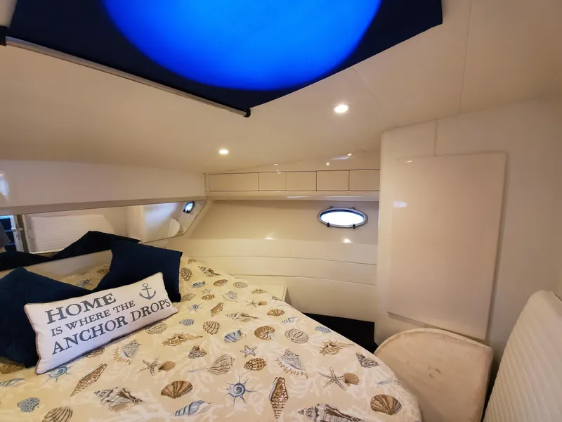 Slide: The Image of Cozy cabin interior of 1993 Giorgi 46 yacht with nautical decor and porthole window. - 24
