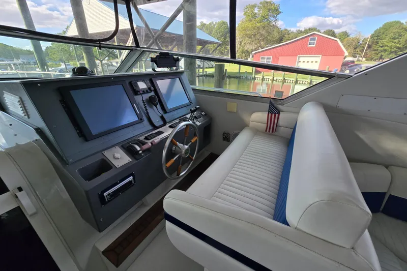 Slide: The Image of Interior of a 1993 Giorgi 46 boat with modern navigation equipment and seating. - 89
