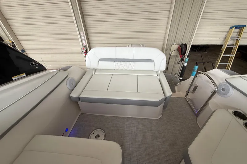 Slide: The Image of 2026 Regal 26 XO boat interior with white seating and modern design. - 15