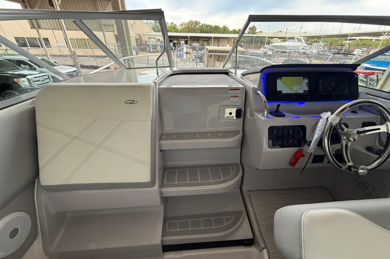 Slide: The Image of 2026 Regal 26 XO boat cockpit with modern steering and navigation system. - 19