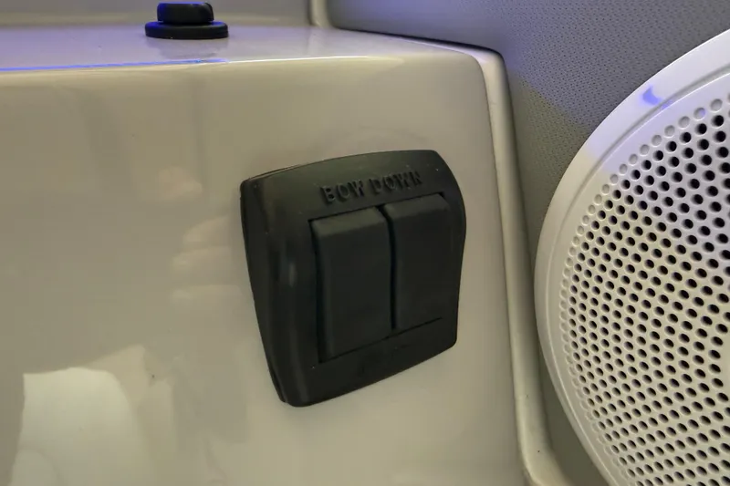 Slide: The Image of 2026 Regal 26 XO boat interior with bow control switch and speaker. - 26