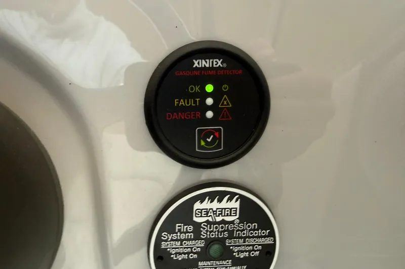 Slide: The Image of Gasoline fume and fire suppression indicators on 2026 Regal 26 XO boat dashboard. - 29