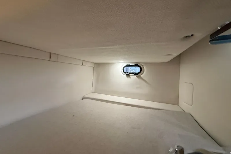 Slide: The Image of Interior cabin of 2026 Regal 26 XO boat with small window. - 34