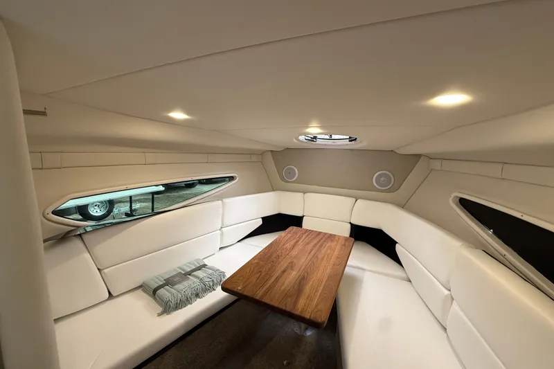 Slide: The Image of Luxurious interior of 2026 Regal 26 XO boat with elegant seating and wooden table. - 35
