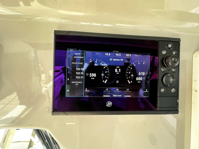 Slide: The Image of Dashboard display of a 2022 Boston Whaler 350 Realm boat showing engine metrics. - 35