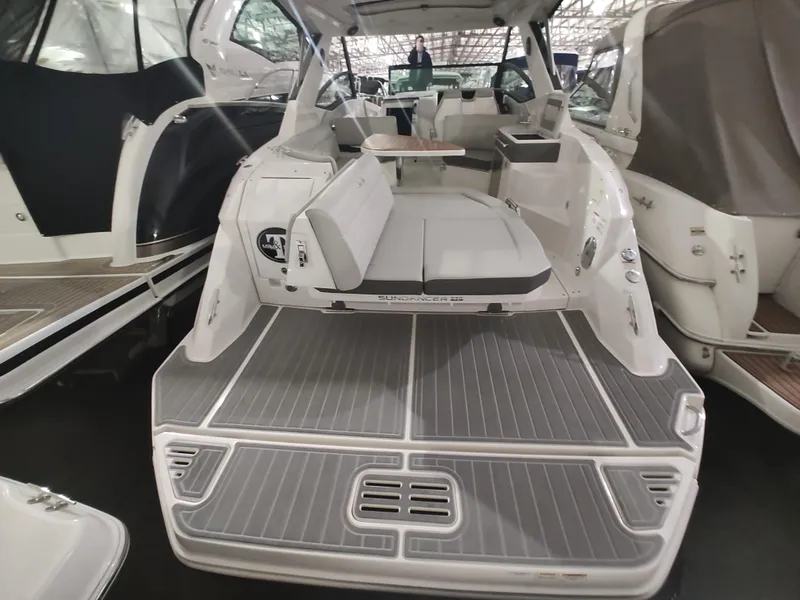 Slide: The Image of 2023 Sea Ray 320 Sundancer boat interior with spacious seating and modern design. - 16