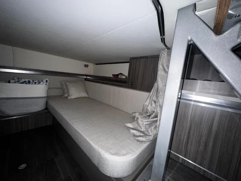 Slide: The Image of 2023 Sea Ray 320 Sundancer cabin interior with a cozy bed and modern design. - 40