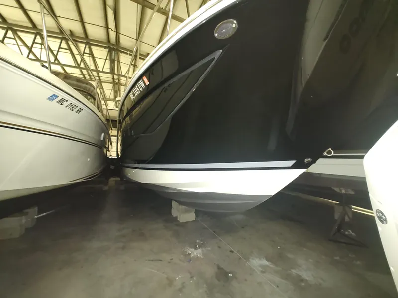 Slide: The Image of 2023 Sea Ray 320 Sundancer boat in storage, side view. - 6