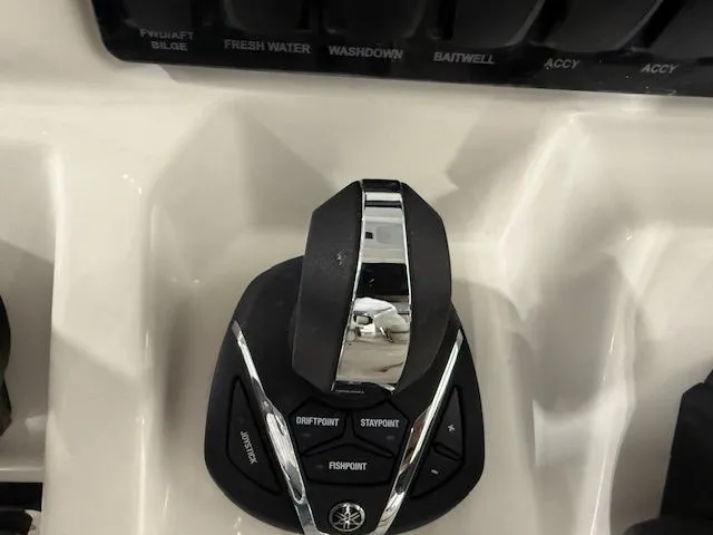 Slide: The Image of Throttle control panel on 2022 Sailfish 290cc boat, featuring various function buttons. - 13