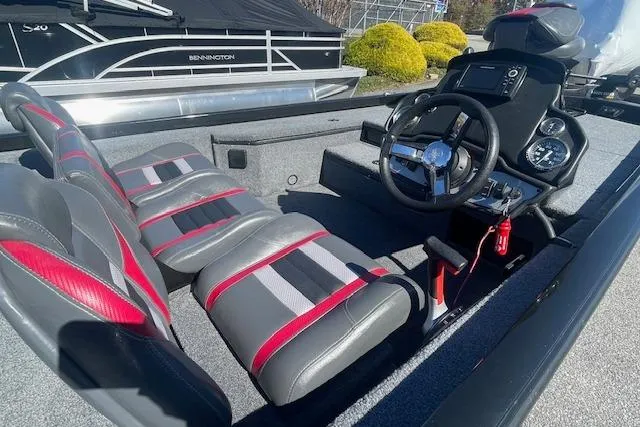 Slide: The Image of 2021 Ranger RT178 boat interior with steering wheel and dual seats. - 8