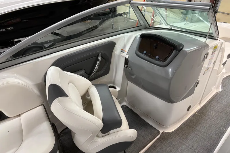Slide: The Image of 2015 Chaparral 244 Sunesta boat interior with white and gray seating. - 10