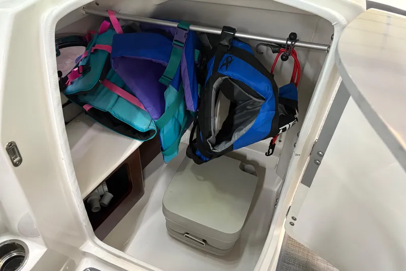 Slide: The Image of Interior of 2015 Chaparral 244 Sunesta boat with modern seating and dashboard. - 11