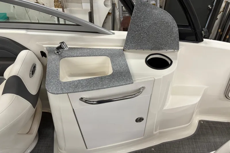 Slide: The Image of Steering console of 2015 Chaparral 244 Sunesta boat with gauges and controls. - 14