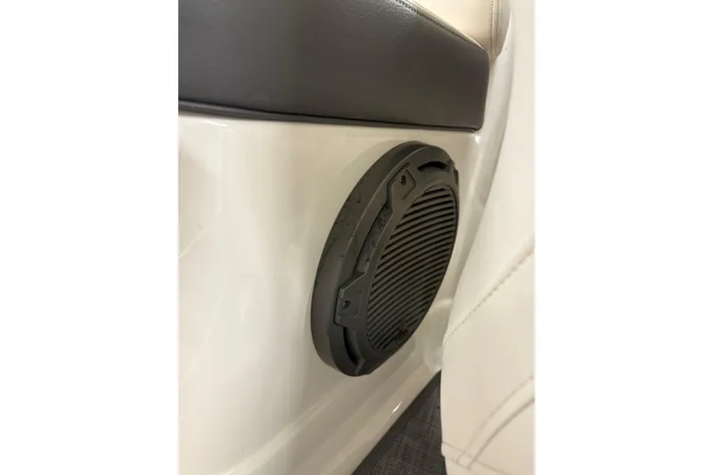 Slide: The Image of 2015 Chaparral 244 Sunesta boat interior with sink and storage compartment. - 15