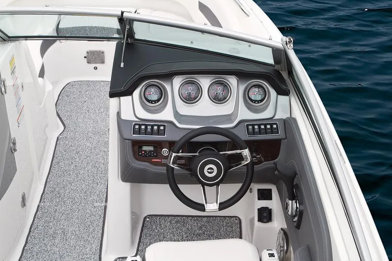 Slide: The Image of Manufacturer Provided Image: 2015 Chaparral 244 Sunesta boat interior with seating, helm, and cabin. - 25