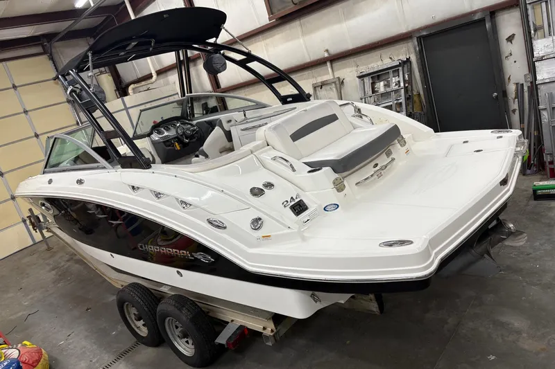 Slide: The Image of 2015 Chaparral 244 Sunesta boat on trailer in a garage setting. - 3