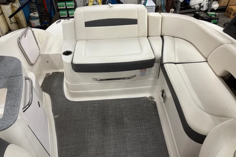 Slide: The Image of 2015 Chaparral 244 Sunesta boat interior with white seating and gray accents. - 5