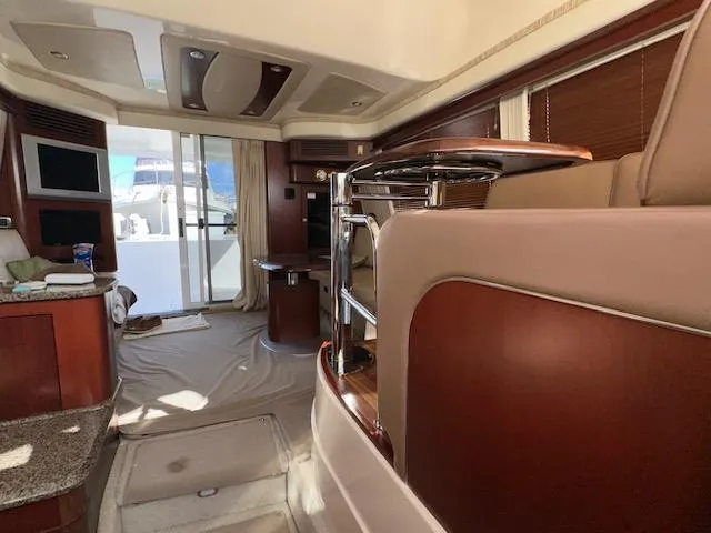 Slide: The Image of Interior of 2006 Sea Ray 44 Sedan Bridge yacht, featuring elegant wood finishes and modern design. - 17