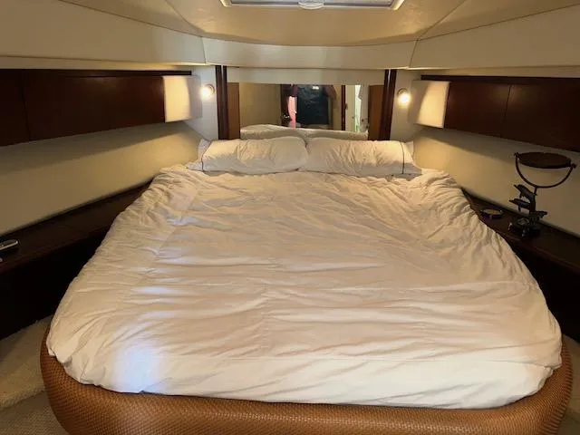 Slide: The Image of Luxurious bedroom interior of 2006 Sea Ray 44 Sedan Bridge yacht. - 20