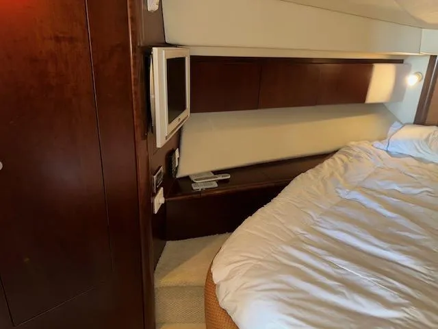 Slide: The Image of Luxurious cabin interior of 2006 Sea Ray 44 Sedan Bridge yacht with cozy bed. - 21