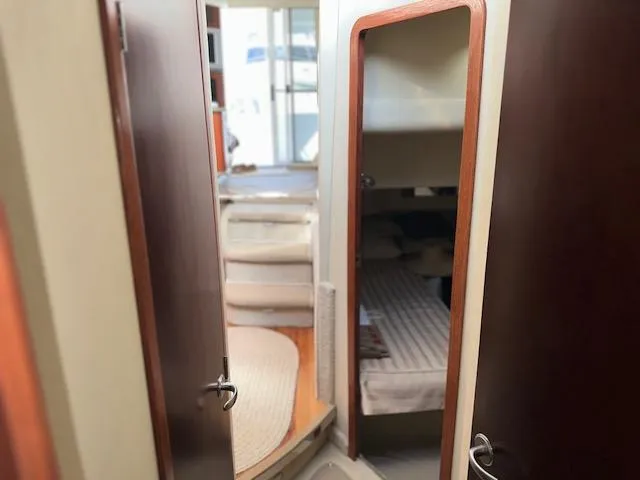 Slide: The Image of Interior view of 2006 Sea Ray 44 Sedan Bridge yacht, featuring cozy cabin and modern design. - 24