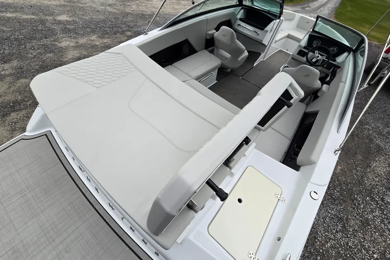 Slide: The Image of 2025 Four Winns H4 Freedom boat interior with modern seating and sleek design. - 14