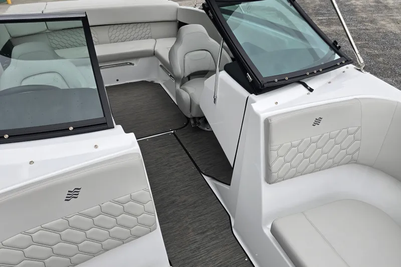 Slide: The Image of Interior detail of 2025 Four Winns H4 Freedom boat, featuring sleek black and white design. - 22