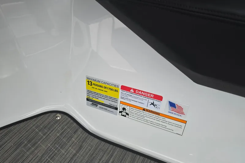 Slide: The Image of Storage compartment in 2025 Four Winns H4 Freedom boat, featuring cup holders and speaker. - 28