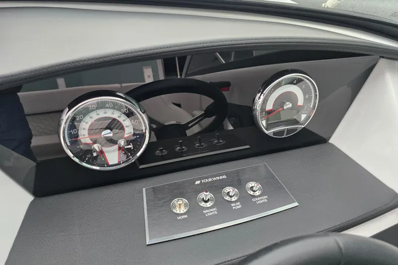 Slide: The Image of Engine compartment of 2025 Four Winns H4 Freedom boat, featuring a 4.5L 250 horsepower engine. - 29