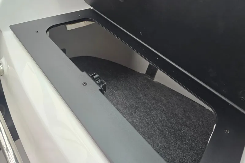 Slide: The Image of 2025 Four Winns H4 Freedom boat interior with white cushioned seating and hexagonal stitching. - 31