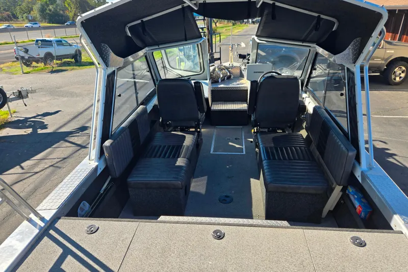 Slide: The Image of 2011 Thunderjet ALEXIS CLASSIC boat interior with seating and dashboard view. - 13