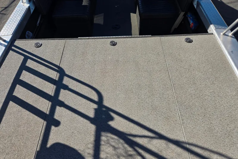 Slide: The Image of 2011 Thunderjet ALEXIS CLASSIC boat deck with shadowed railing and seating area. - 14