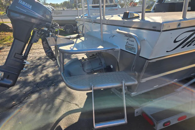 Slide: The Image of 2011 Thunderjet Alexis Classic boat with Yamaha outboard motor, rear view. - 15
