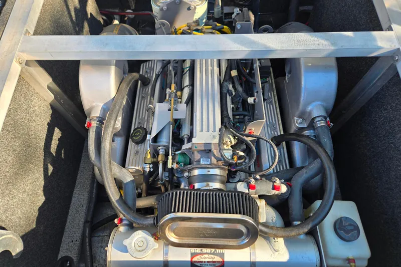 Slide: The Image of 2011 Thunderjet ALEXIS CLASSIC engine compartment with visible components and wiring. - 16