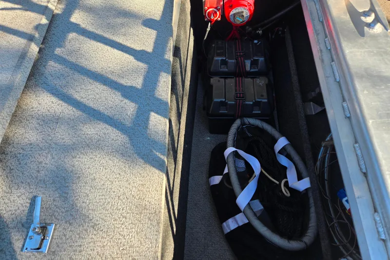 Slide: The Image of 2011 Thunderjet ALEXIS CLASSIC boat interior with battery storage and safety equipment. - 19