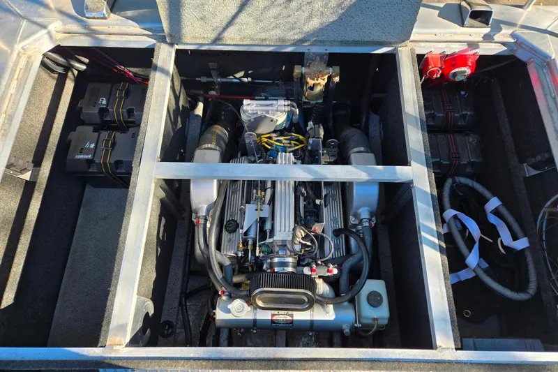 Slide: The Image of Engine compartment of a 2011 Thunderjet ALEXIS CLASSIC boat, showcasing detailed components. - 23