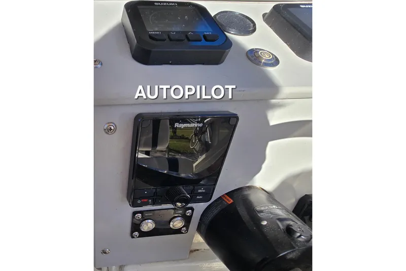 Slide: The Image of Autopilot system on 1990 Hydra-Sports 2500WA boat dashboard with Raymarine controls. - 13