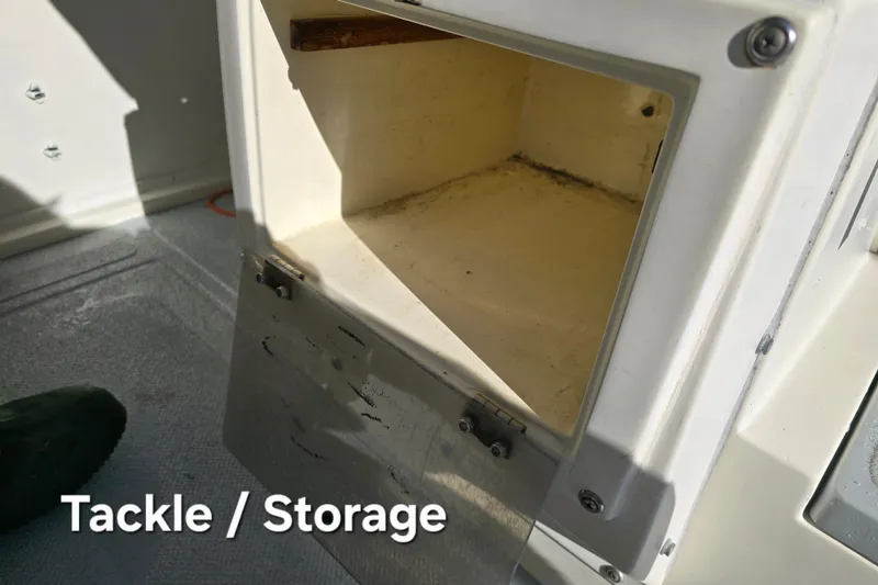 Slide: The Image of Open tackle storage compartment on 1990 Hydra-Sports 2500WA boat. - 17