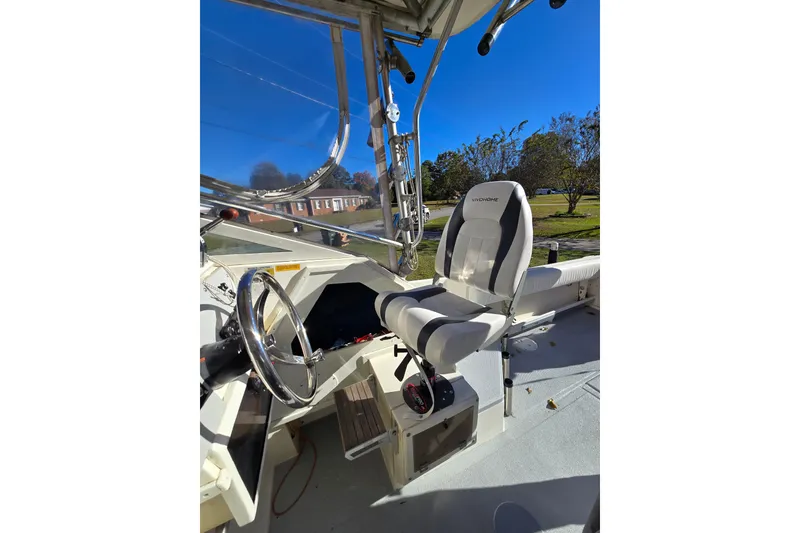 Slide: The Image of 1990 Hydra-Sports 2500WA boat interior with steering wheel and seating. - 26