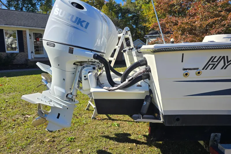 Slide: The Image of 1990 Hydra-Sports 2500WA boat with Suzuki outboard motor on grassy lawn. - 30