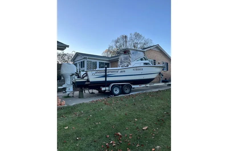 Slide: The Image of 1990 Hydra-Sports 2500WA boat on trailer, parked in residential driveway. - 34