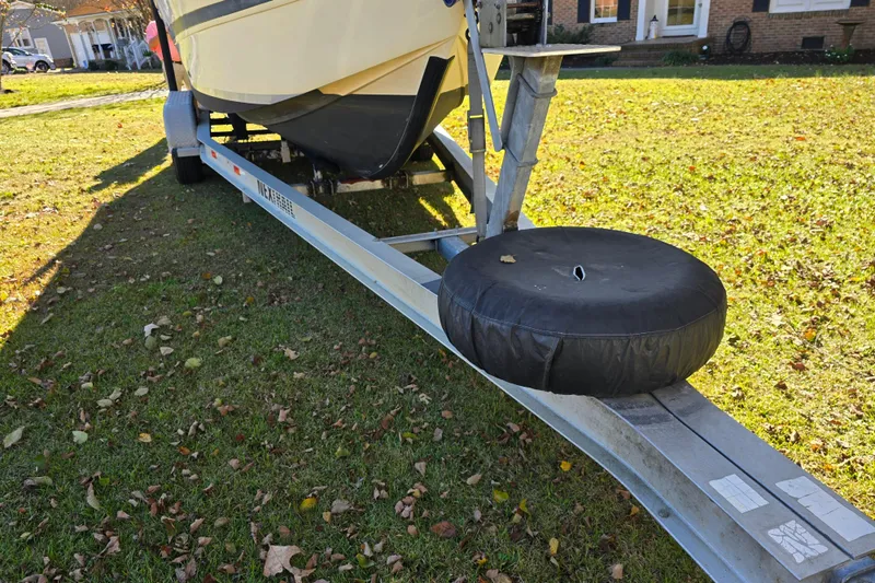 Slide: The Image of 1990 Hydra-Sports 2500WA boat on trailer, parked on grassy lawn. - 9