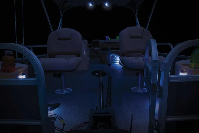 Slide: The Image of 2017 Sun Tracker Fishin' Barge 22 XP3 pontoon boat, rear view with motor and trailer. - 17