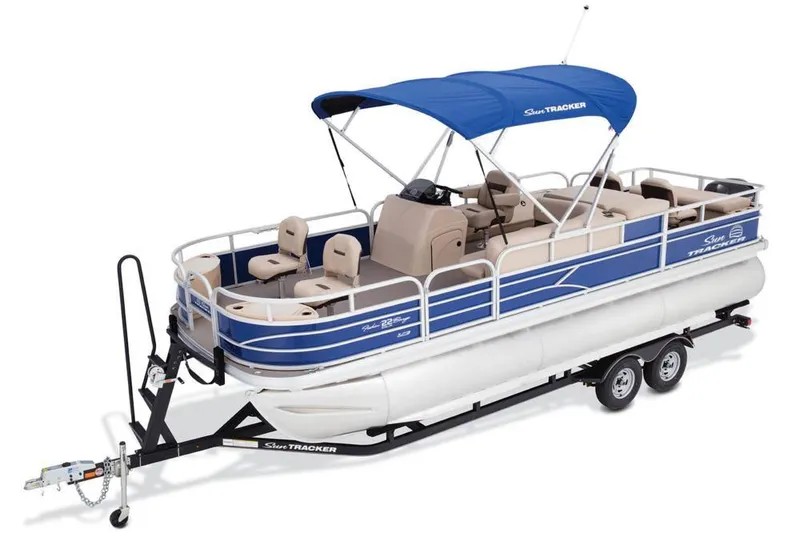 Slide: The Image of 2017 Sun Tracker Fishin' Barge 22 XP3 pontoon boat with beige seating and blue canopy. - 2