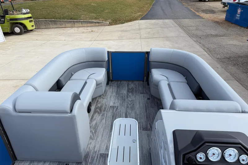 Slide: The Image of 2026 Bentley Pontoons Legacy 223 Cruise XL interior with gray seating and modern dashboard. - 14